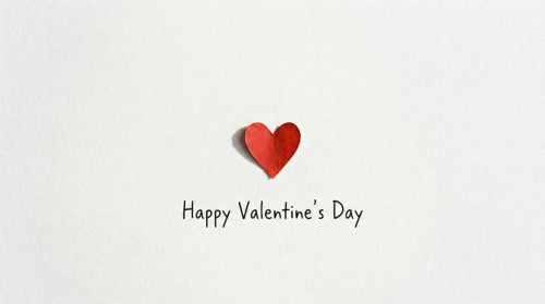 A minimalist Valentine's Day greetings card featuring wreath and elegant lettering to convey