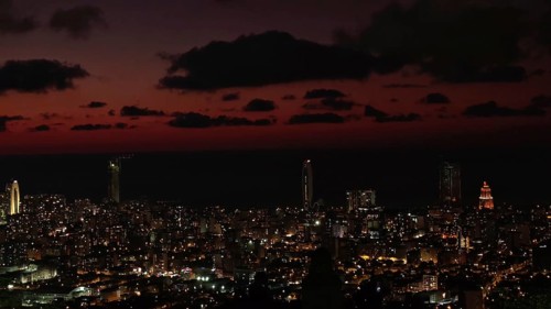 City view at night with illuminated buildings and dark sky, Batumi, Georgia