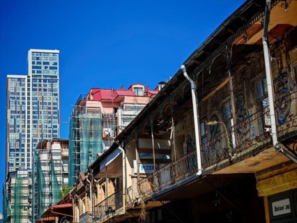 Modern and old architecture contrasting under clear skies, Batumi, Georgia