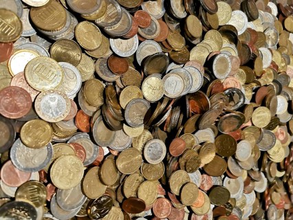 Different coins in a colorful collection in a heap