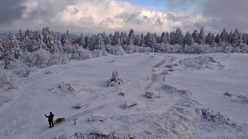 Snowy landscape with a wide view under blue, cloudy sky. Lonely and quiet, Schneeberg,