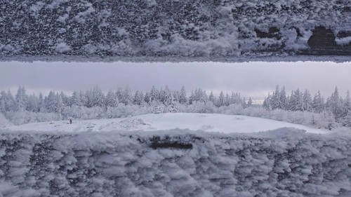 Snowy landscape with views of a forest from the viewpoint. Quiet, cold atmosphere, Schneeberg,