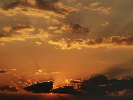Dramatic sunset with glowing clouds and rays
