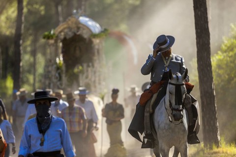 Donana National Park, Almonte, Huelva, Spain. Revellers in traditional equestrian clothes or