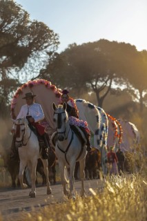 Donana National Park, Almonte, Huelva, Spain. A couple in traditional equestrian clothes during the