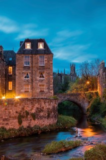 Dean Village, Edinburgh, Scotland, UK. Traditional houses and church with canal in historic Dean