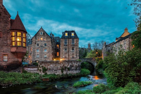 Dean Village, Edinburgh, Scotland, UK. Traditional houses and church with canal in historic Dean