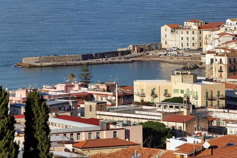 View of Cefalù in winter, view over the rooftops of the harbor and the Tyrrhenian Sea, medieval old