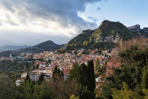 View of picturesque town, hills and mountains, panoramic view, Taormina, Sicily, Italy