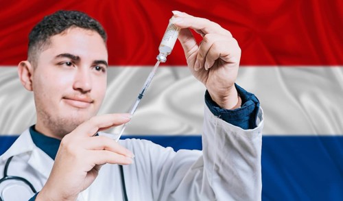 Doctor holding syringe on Netherlands flag background. Medical professional holding syringe with