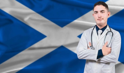 Portrait of medical professional on Scotland flag background. Scottish national health system