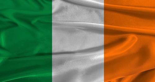 Flag of Ireland with fabric textured background. Close up of National flag of Ireland with