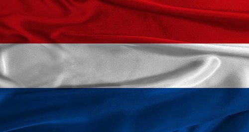 Flag of the Netherlands with fabric textured background. Close up of National flag of the