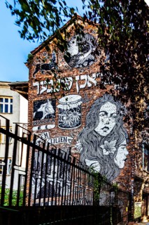 Street art on the wall of a building in the Kazimierz Jewish Quarter, a historically significant,