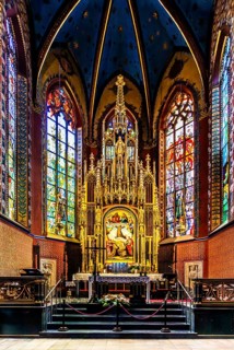 Wyspianski stained glass window and main altar in the presbytery, Franciscan Church, 1249, Krakow,