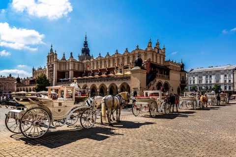 Carriage in front of Rynek with Cloth Hall, from 13th century, Main Market Square, landmark of the