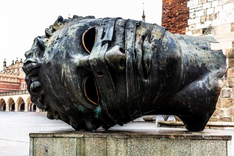 Eros Bendato, modern bronze head, rynek with cloth halls, from 13th century, main market square,