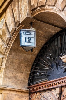 Typical house number lanterns, details of old town lanes, Krakow, Poland