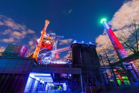 Bright and colorful lighting of an industrial plant at night, Landschaftspark Duisburg Nord,