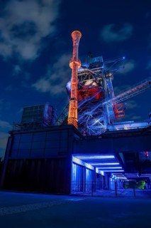 Futuristic industrial plant in glowing night light, Landschaftspark Duisburg Nord, Duisburg, North