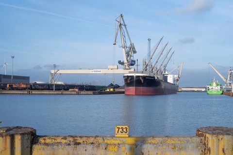 View across a harbor basin to the Huttenhafen industrial area in Bremen, Germany