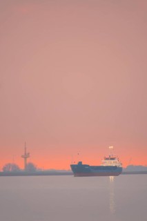 View of a ship on the Weser at sunset, Bremerhaven, Bremen, Germany