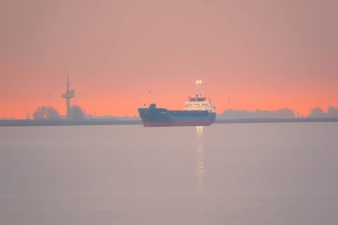 View of a ship on the Weser at sunset, Bremerhaven, Bremen, Germany