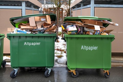 Overfilled paper bins on collection day, Eckental, Middle Franconia, Bavaria, Germany