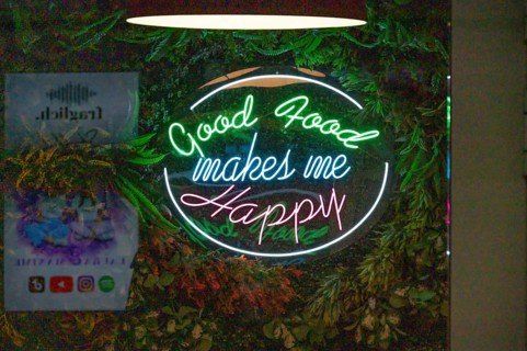 Illuminated advertising at a restaurant, Nuremberg, Middle Franconia, Bavaria, Germany