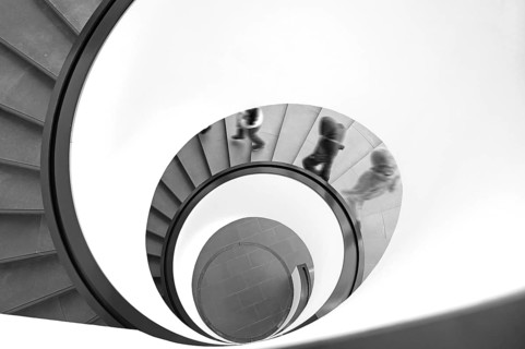 People walking downhill on a spiral staircase, movement, black and white, Nuremberg, Middle