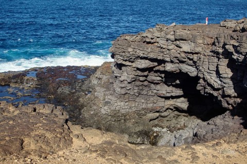 Rugged coastal formation with dramatic cliffs and breaking waves, Playa Blanca Lanzarote