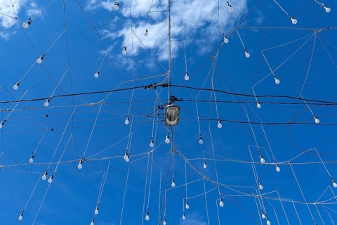 Light bulbs for evening lighting against blue sky, Cluj-Napoca, Transylvania, Romania