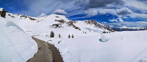 Alpine mountain panorama with hiking trail in snow on the Fellhorn in spring in the Allgäu Alps in