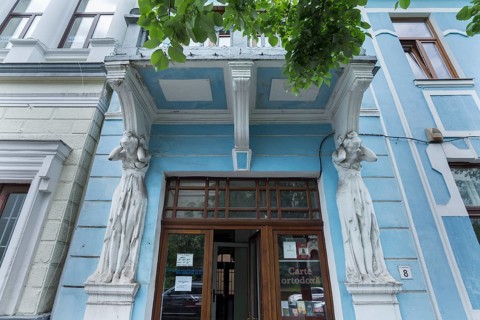 Caryatids under a balcony of a 19th century house, Cluj-Napoca, Transylvania, Romania