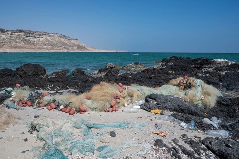 Garbage, fishing nets and plastic on the beach, Oman