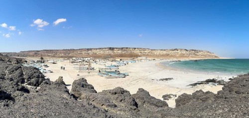 Fishing village with boats on the beach, near Ras Madrakah, Oman