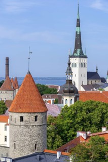 City wall towers and spire of the Baptist St. Olaf's Church, Oleviste kirik in the Old Town of the