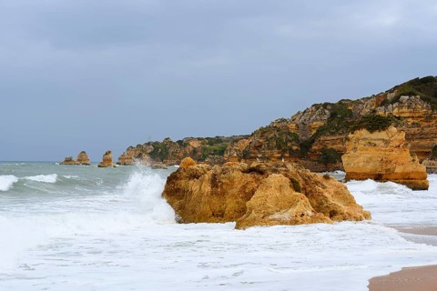 Rocks on the coast in the surf, Praia Dona Ana, Lagos, Algarve, Portugal