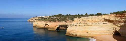 Rocky coast with caves, Praia da Corredoura, Algarve, Portugal