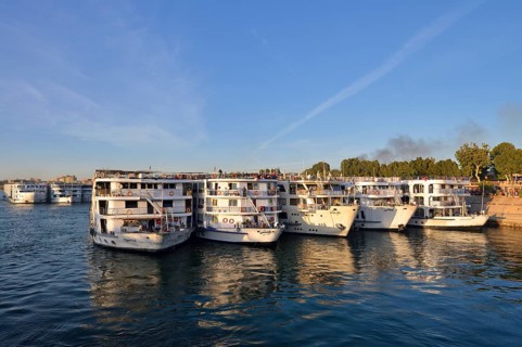 Nile cruise ships at the pier at the double temple of Kom Ombo, Kom Ombo, Egypt