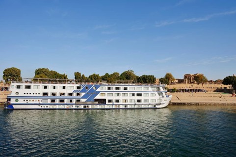 Nile cruise ship Radamis II at pier and double temple of Kom Ombo, Kom Ombo, Egypt