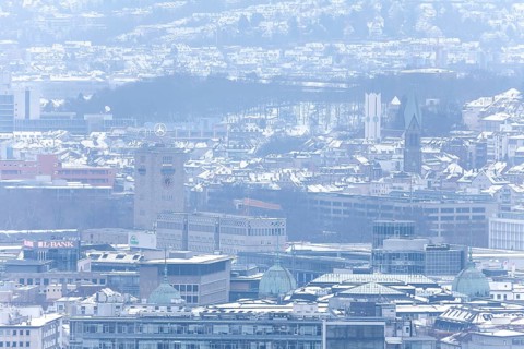 March 18, 2018, winter view with snow toward city center with station and tower from Mount