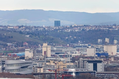 30.03.2018: Zoomed view of city roofs, towers and industrial buildings. Stuttgart,