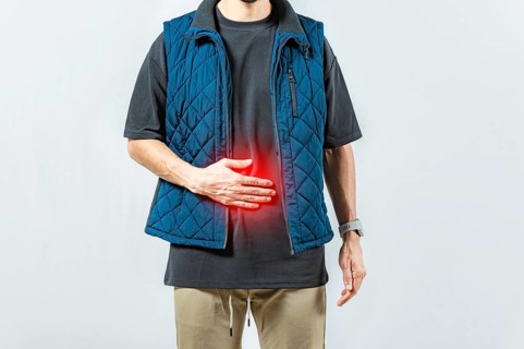 Person with digestive and stomach problems isolated. Unhappy man with digestive problems isolated