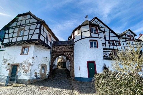 Castle gate in historic Burgbering from access to medieval Höhenburg Reifferscheid Castle Excursion