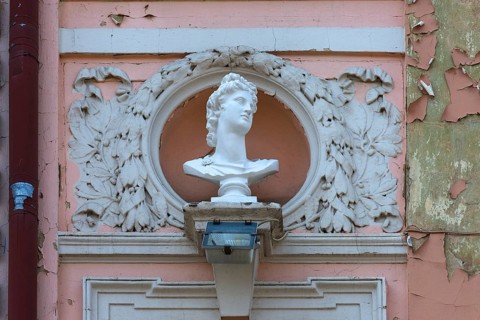 Bust on a dilapidated 19th century house façade, Czernowicz, Ukraine