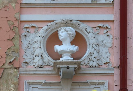 Bust of a woman on a dilapidated 19th century house façade, Czernowicz, Ukraine