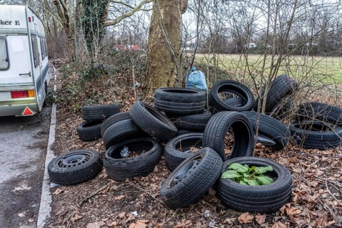 Illegally disposed of car tires and other trash, on a side street in Duisburg-Kaiserberg, North