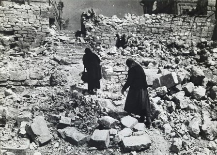 Two old woman in the rubble of a destroyed residential building, April 1945, Berlin