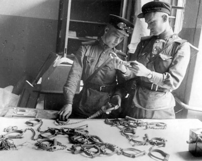 Soviet soldiers in the Gestapo building, handcuffs, May 1945, Berlin, Germany